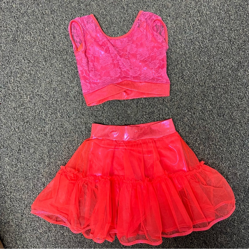 Curtain call pink and orange dance costume.